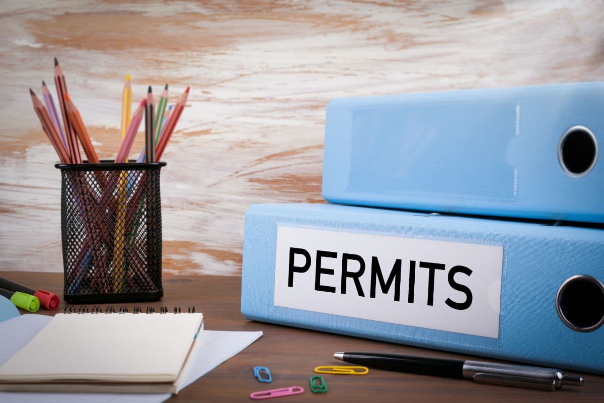 Basement renovation with building permits and blueprints