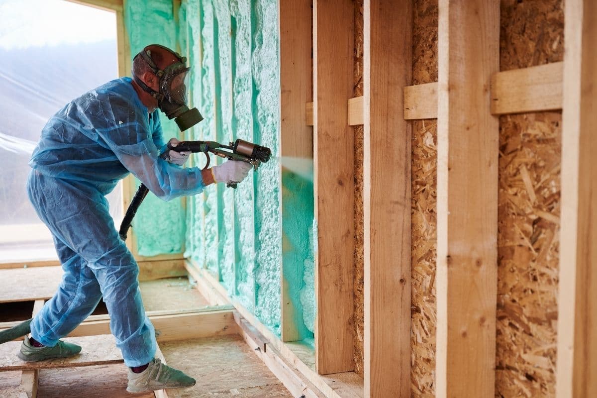 Spray foam insulation being applied to basement walls